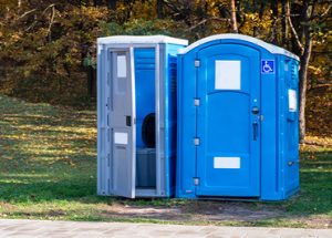 wheelchair accessible porta potty in a park